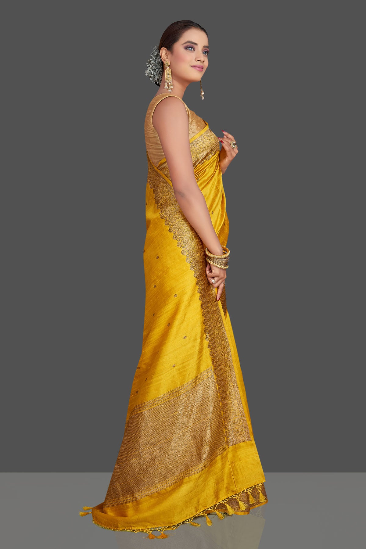 Shop gorgeous yellow tussar Banarasi saree online in USA with antique zari border. Look your best on special occasions with stunning Banarasi saris, pure silk saris, tussar sarees, handwoven sarees from Pure Elegance Indian saree store in USA.-side