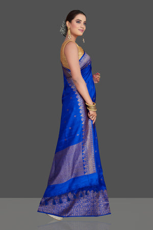 Buy stunning bright blue tussar Banarasi saree online in USA with antique zari border. Look your best on special occasions with stunning Banarasi saris, pure silk sarees, tussar sarees, handwoven sarees from Pure Elegance Indian saree store in USA.-side