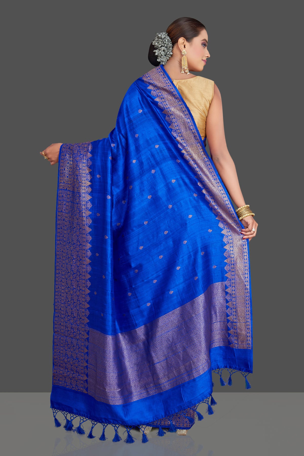 Buy stunning bright blue tussar Banarasi saree online in USA with antique zari border. Look your best on special occasions with stunning Banarasi saris, pure silk sarees, tussar sarees, handwoven sarees from Pure Elegance Indian saree store in USA.-back