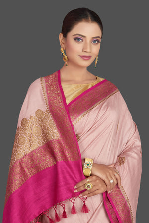 Buy beautiful light pink tussar Banarasi saree online in USA with dark pink border. Look your best on special occasions with stunning Banarasi saris, pure silk saris, tussar sarees, handwoven sarees from Pure Elegance Indian saree store in USA.-closeup