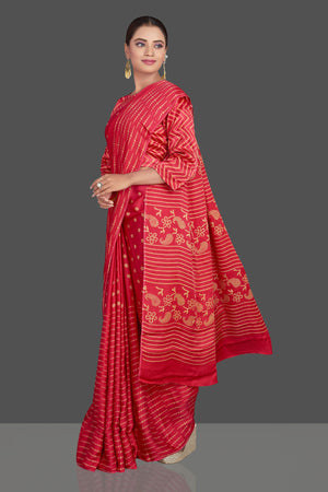 Buy gorgeous red printed modal silk sari online in USA. Make your presence felt on special occasions in beautiful embroidered sarees, handwoven sarees, pure silk sarees, tussar sarees from Pure Elegance Indian saree store in USA.-left