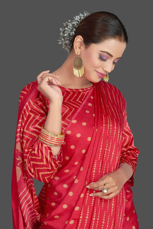 Buy gorgeous red printed modal silk sari online in USA. Make your presence felt on special occasions in beautiful embroidered sarees, handwoven sarees, pure silk sarees, tussar sarees from Pure Elegance Indian saree store in USA.-closeup