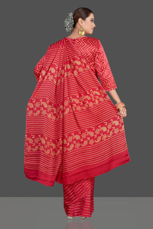 Buy gorgeous red printed modal silk sari online in USA. Make your presence felt on special occasions in beautiful embroidered sarees, handwoven sarees, pure silk sarees, tussar sarees from Pure Elegance Indian saree store in USA.-back