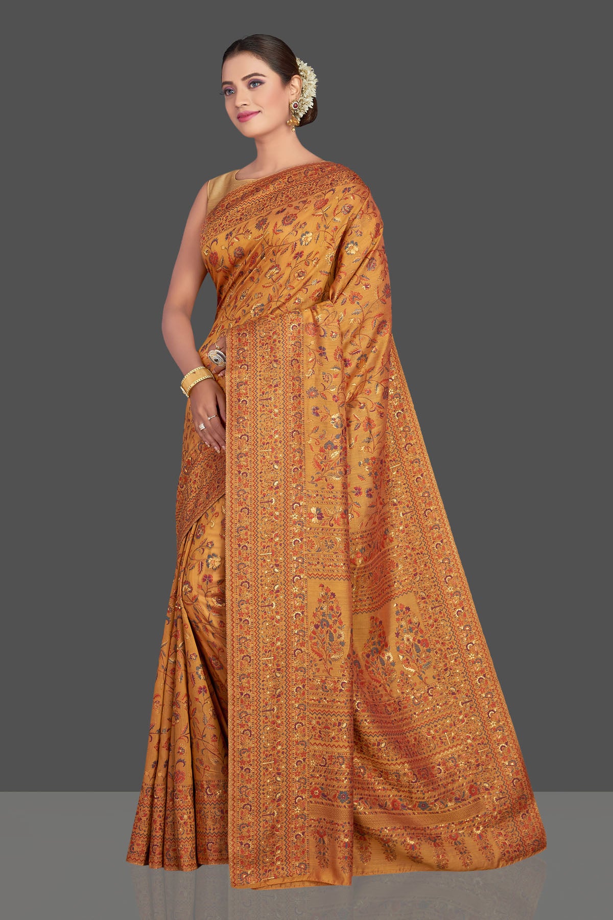 Buy stunning mustard yellow Kani weave sari online in USA. Make your presence felt on special occasions in beautiful embroidered sarees, handwoven saris, pure silk saris, tussar sarees from Pure Elegance Indian saree store in USA.-pallu