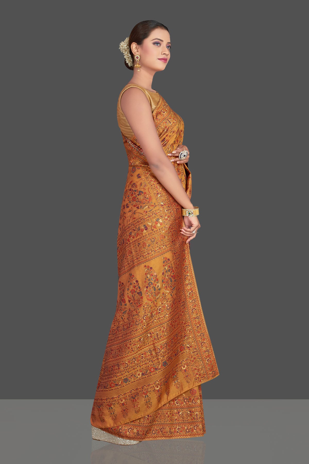 Buy stunning mustard yellow Kani weave sari online in USA. Make your presence felt on special occasions in beautiful embroidered sarees, handwoven saris, pure silk saris, tussar sarees from Pure Elegance Indian saree store in USA.-right