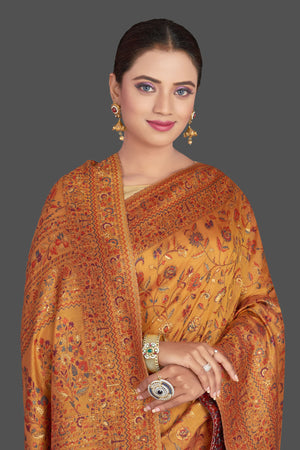 Buy stunning mustard yellow Kani weave sari online in USA. Make your presence felt on special occasions in beautiful embroidered sarees, handwoven saris, pure silk saris, tussar sarees from Pure Elegance Indian saree store in USA.-closeup