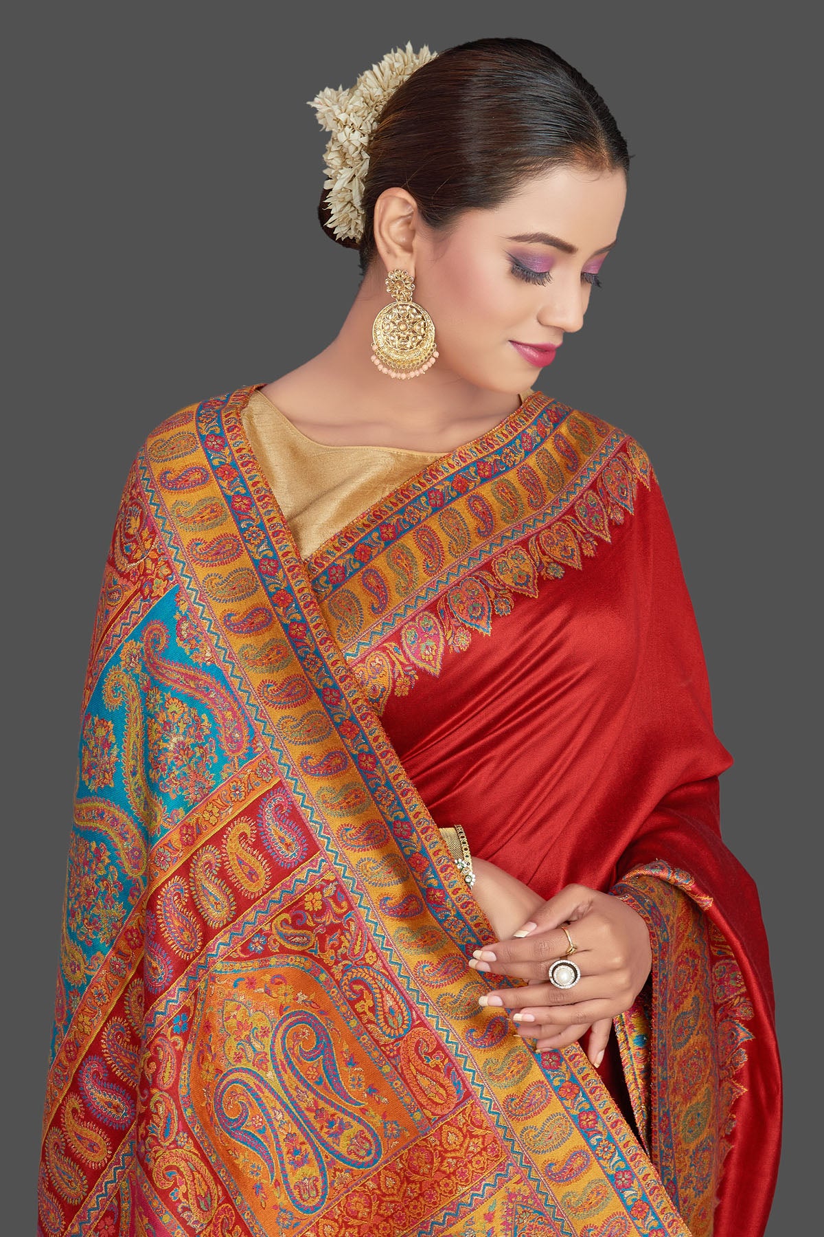 Buy stunning red Kani weave tussar muga silk sari online in USA. Make your presence felt on special occasions in beautiful embroidered sarees, handwoven saris, pure silk saris, tussar sarees from Pure Elegance Indian saree store in USA.-closeup