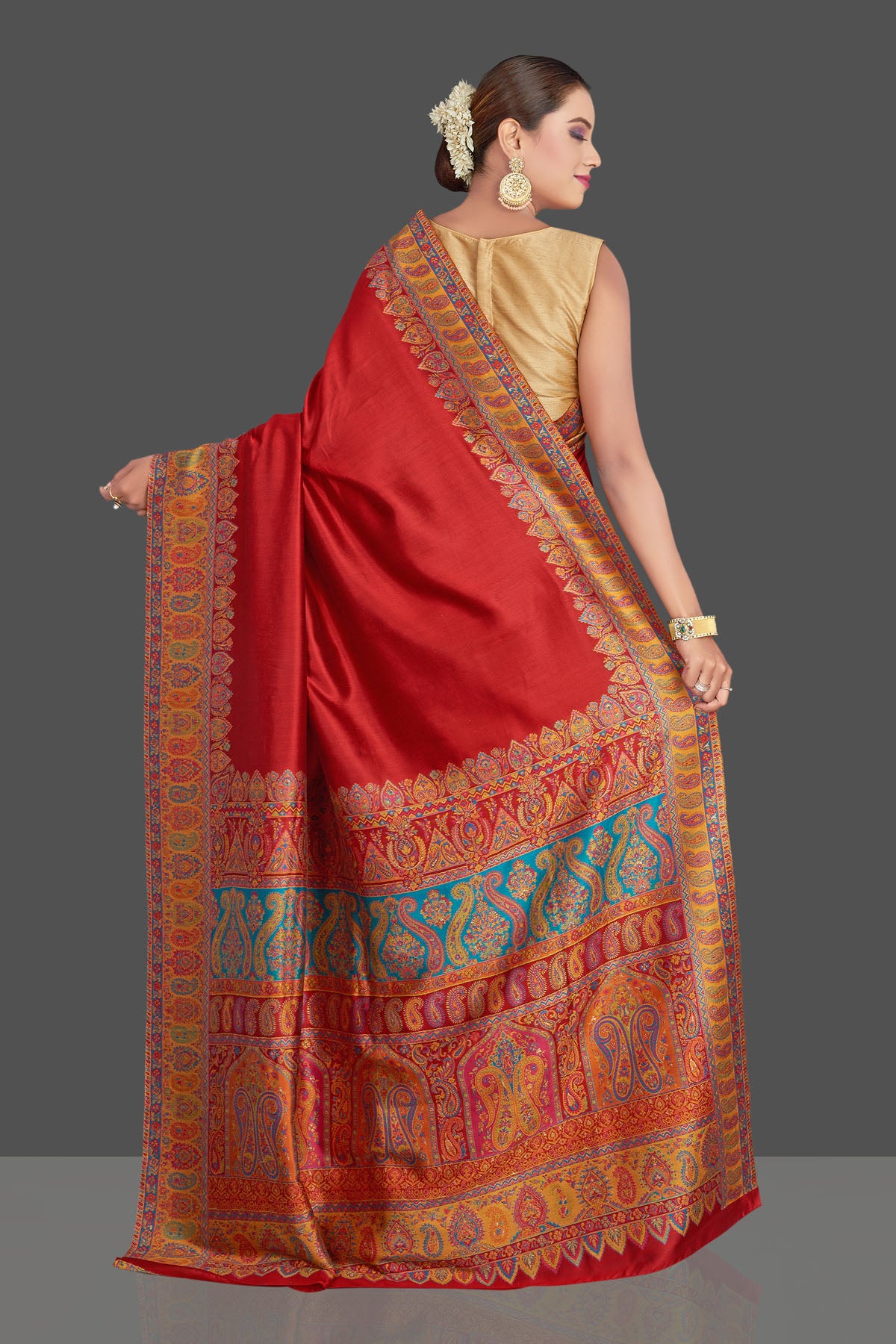 Buy stunning red Kani weave tussar muga silk sari online in USA. Make your presence felt on special occasions in beautiful embroidered sarees, handwoven saris, pure silk saris, tussar sarees from Pure Elegance Indian saree store in USA.-back