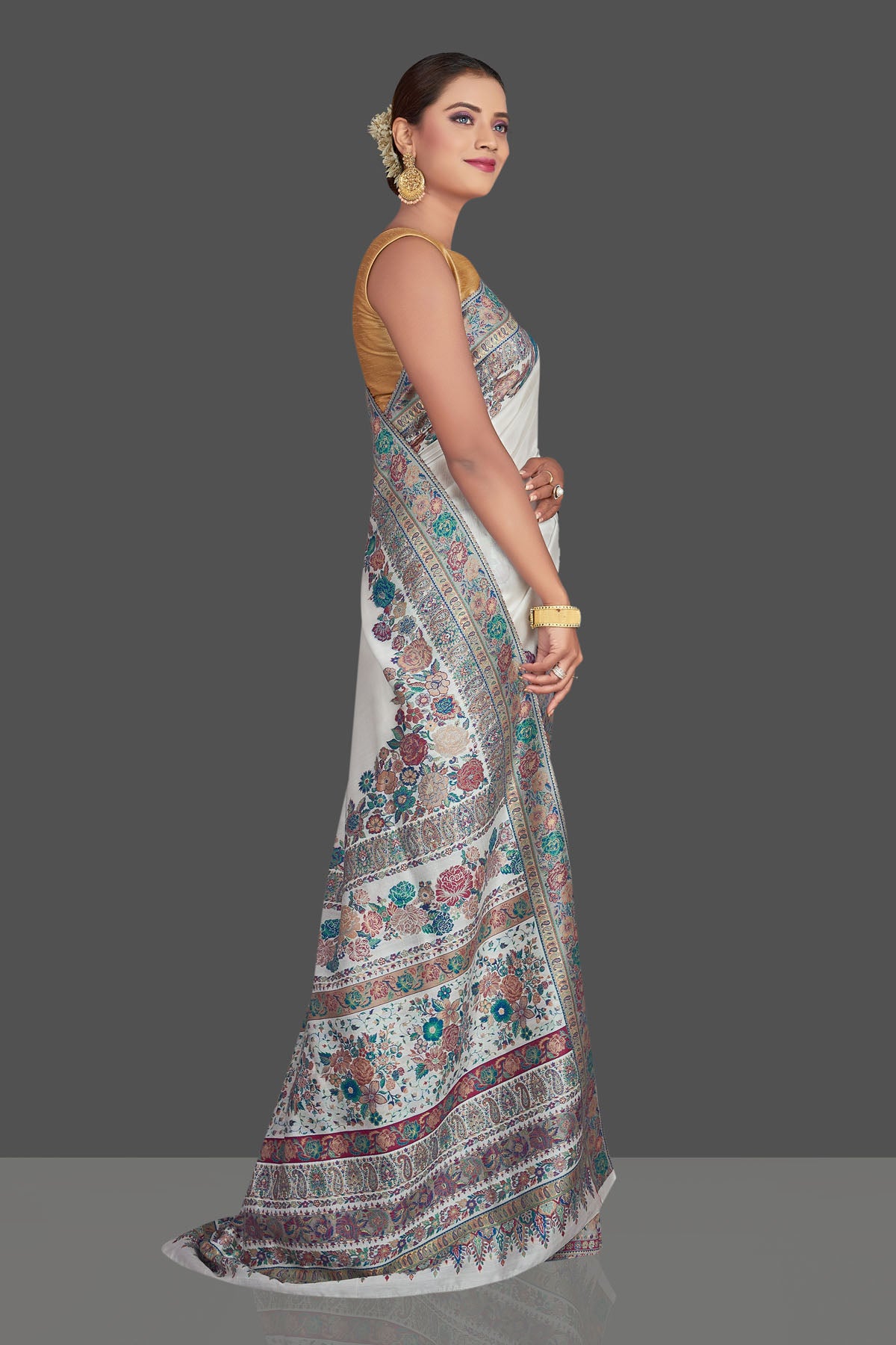Buy stunning off-white Kani weave tussar muga silk sari online in USA. Make your presence felt on special occasions in beautiful embroidered sarees, handwoven saris, pure silk saris, tussar sarees from Pure Elegance Indian saree store in USA.-right