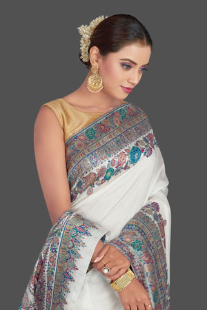 Buy stunning off-white Kani weave tussar muga silk sari online in USA. Make your presence felt on special occasions in beautiful embroidered sarees, handwoven saris, pure silk saris, tussar sarees from Pure Elegance Indian saree store in USA.-closeup