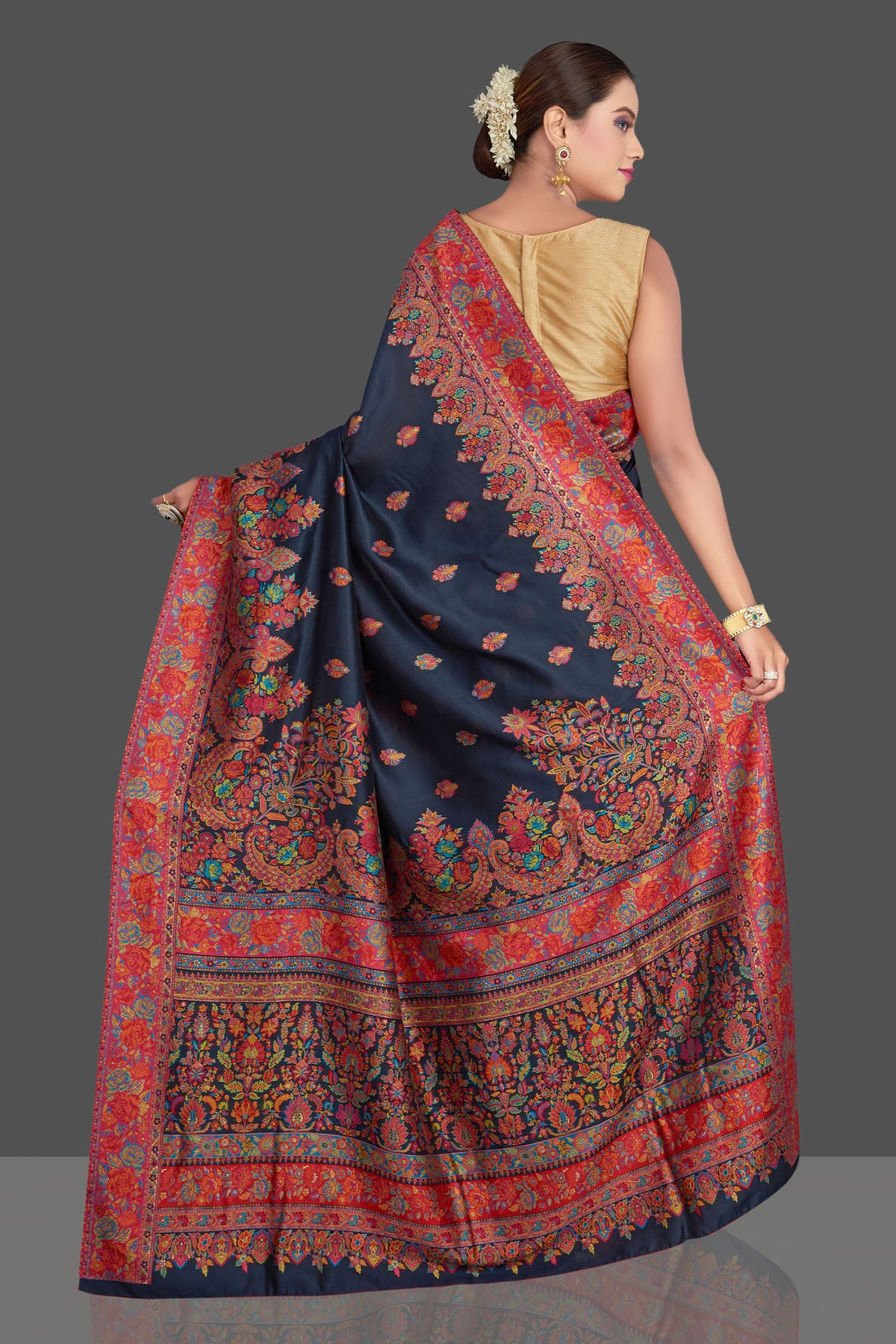 Buy beautiful navy blue tussar muga silk sari online in USA with Kani weave. Make your presence felt on special occasions in beautiful embroidered sarees, handwoven saris, pure silk saris, tussar sarees from Pure Elegance Indian saree store in USA.-back