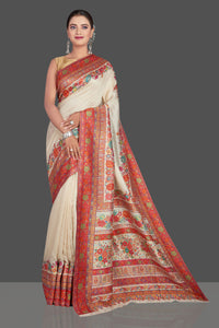 Shop stunning cream Kani weave tussar muga silk saree online in USA. Make your presence felt on special occasions in beautiful embroidered sarees, handwoven saris, pure silk saris, tussar sarees from Pure Elegance Indian saree store in USA.-full view