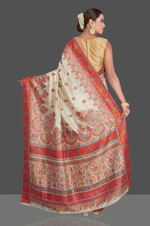 Shop stunning cream tussar muga silk saree online in USA with Kani weave. Make your presence felt on special occasions in beautiful embroidered sarees, handwoven saris, pure silk saris, tussar sarees from Pure Elegance Indian saree store in USA.-back