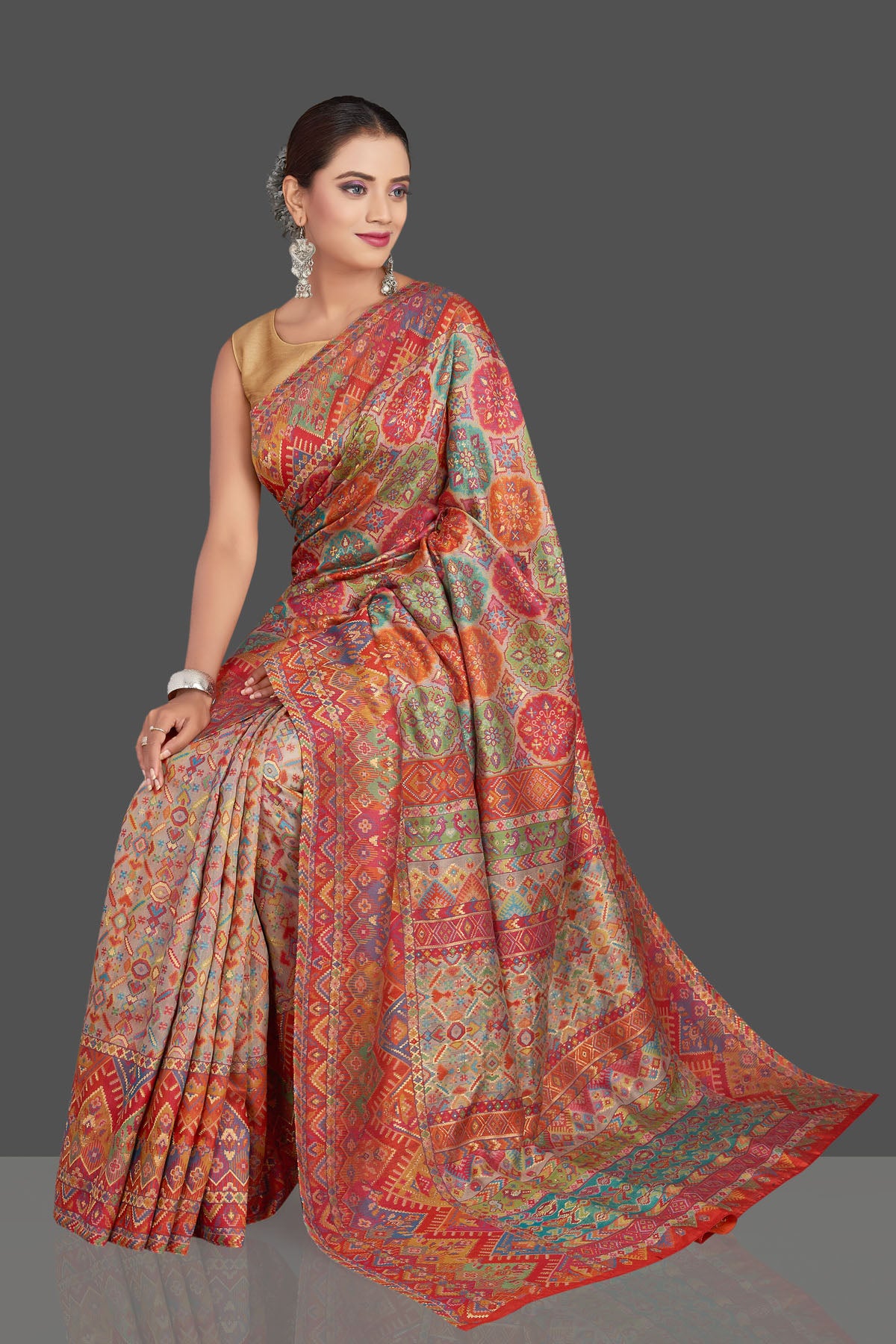 Buy beautiful multicolor Kani weave tussar muga silk saree online in USA. Make your presence felt on special occasions in beautiful embroidered sarees, handwoven saris, pure silk saris, tussar sarees from Pure Elegance Indian saree store in USA.-sitting