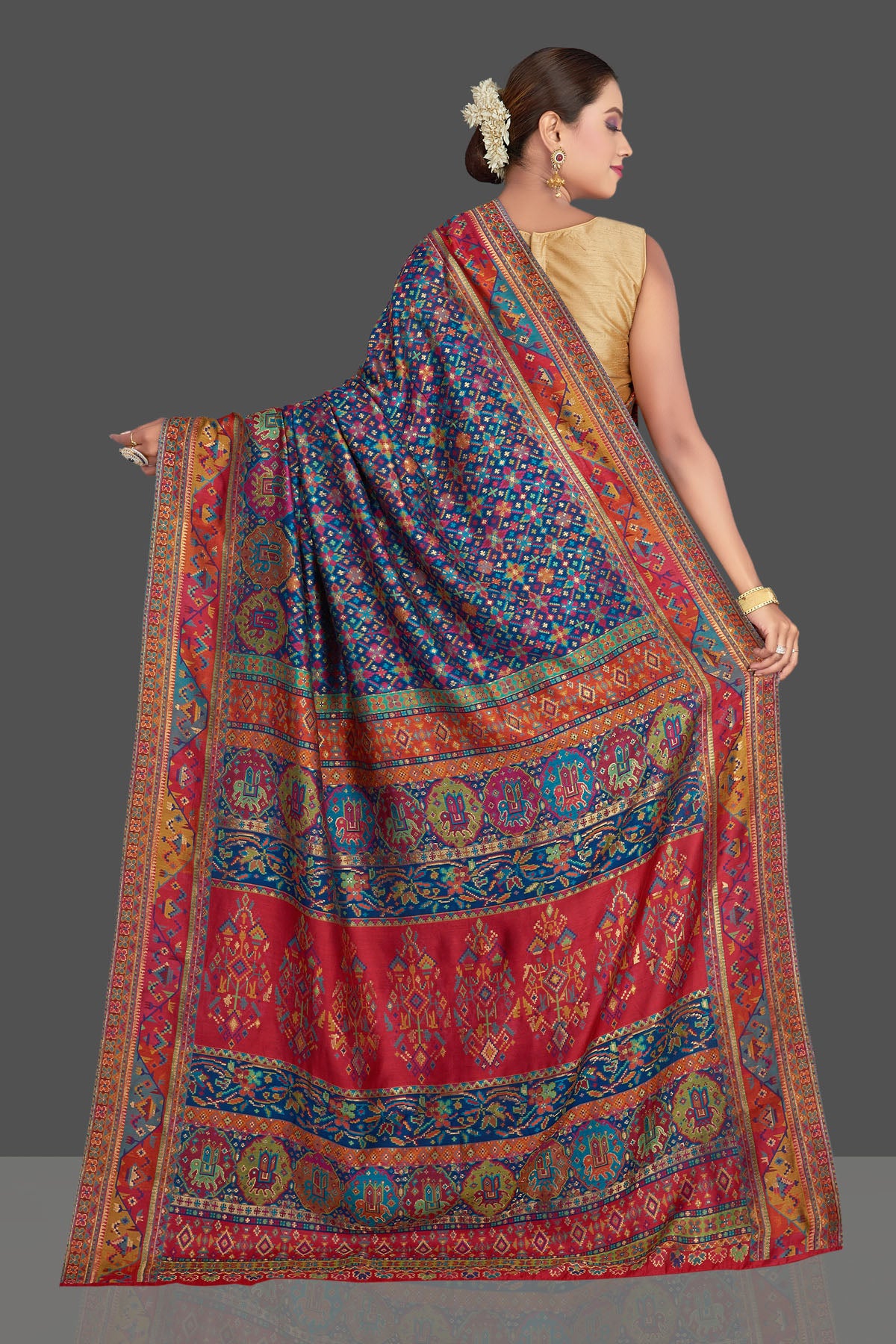 Buy gorgeous blue tussar muga silk saree online in USA with multicolor Kani weave. Make your presence felt on special occasions in beautiful embroidered sarees, handwoven saris, pure silk saris, tussar sarees from Pure Elegance Indian saree store in USA.-back