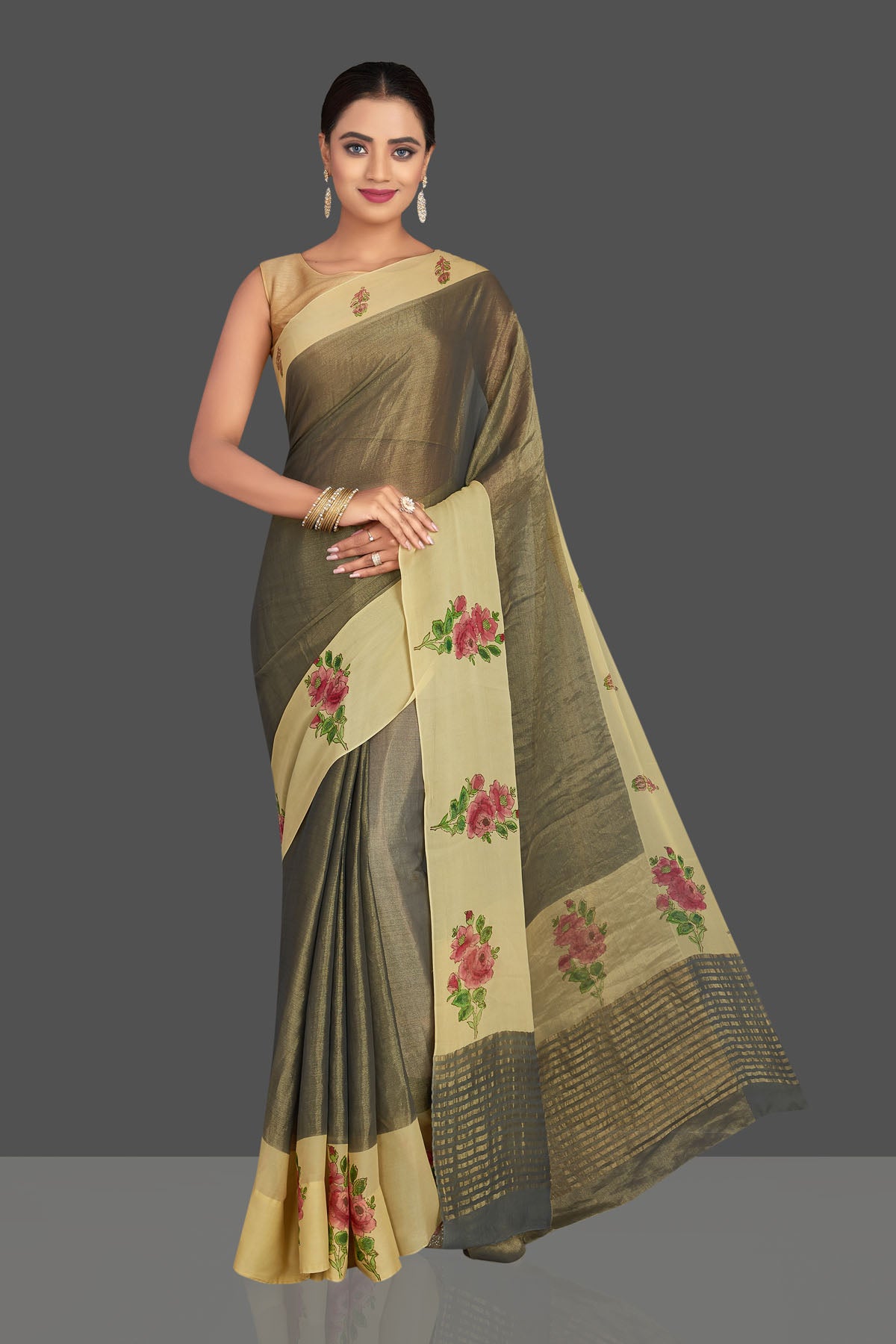Shop stunning dull gold tissue saree online in USA with floral print border. Shop designer sarees, printed sarees, embroidered sarees, crepe sarees in USA from Pure Elegance Indian fashion store in USA.-front