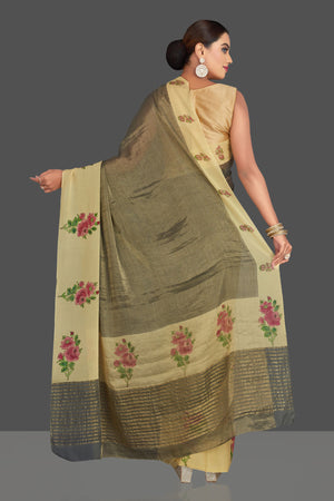 Shop stunning dull gold tissue saree online in USA with floral print border. Shop designer sarees, printed sarees, embroidered sarees, crepe sarees in USA from Pure Elegance Indian fashion store in USA.-back