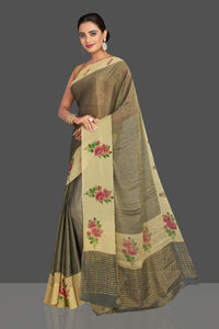 Shop stunning dull gold tissue saree online in USA with floral print border. Shop designer sarees, printed sarees, embroidered sarees, crepe sarees in USA from Pure Elegance Indian fashion store in USA.-full view
