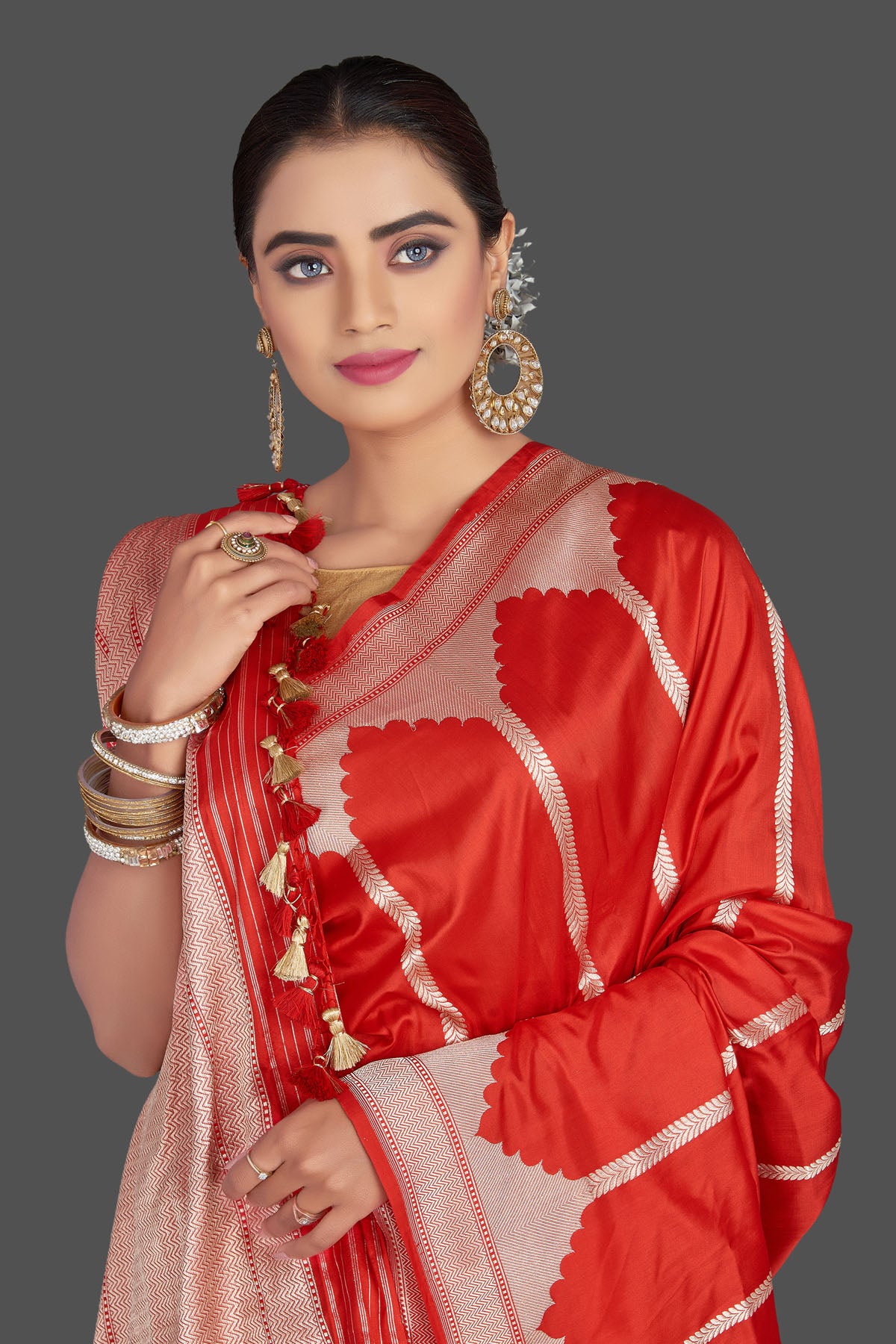 Shop stunning red Katan silk saree online in USA with golden zari border. Be the talk of the occasion in beautiful designer sarees, tussar silk saris, georgette sarees, handloom sarees, pure silk sarees from Pure Elegance Indian saree store in USA.-closeup