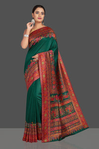 Shop stunning dark green Kani weave tussar muga sari online in USA. Shop designer sarees, printed sarees, embroidered sarees, crepe sarees in USA from Pure Elegance Indian fashion store in USA.-full view