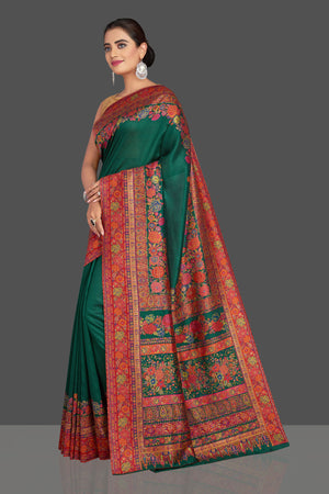 Shop stunning dark green Kani weave tussar muga sari online in USA. Shop designer sarees, printed sarees, embroidered sarees, crepe sarees in USA from Pure Elegance Indian fashion store in USA.-side