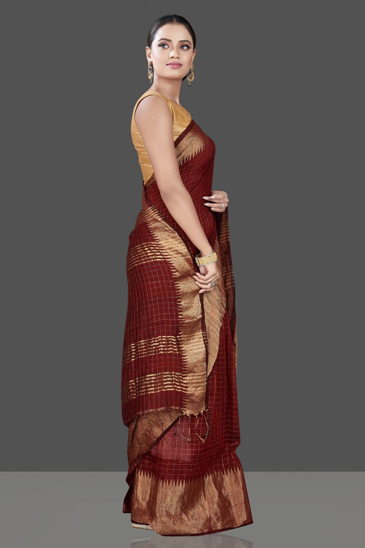 Buy stunning brown check matka silk saree online in USA with golden zari border. Be the talk of the occasion in exquisite designer sarees, pure silk sarees, tussar saris, embroidered sarees, handloom saris from Pure Elegance Indian fashion store in USA.-side