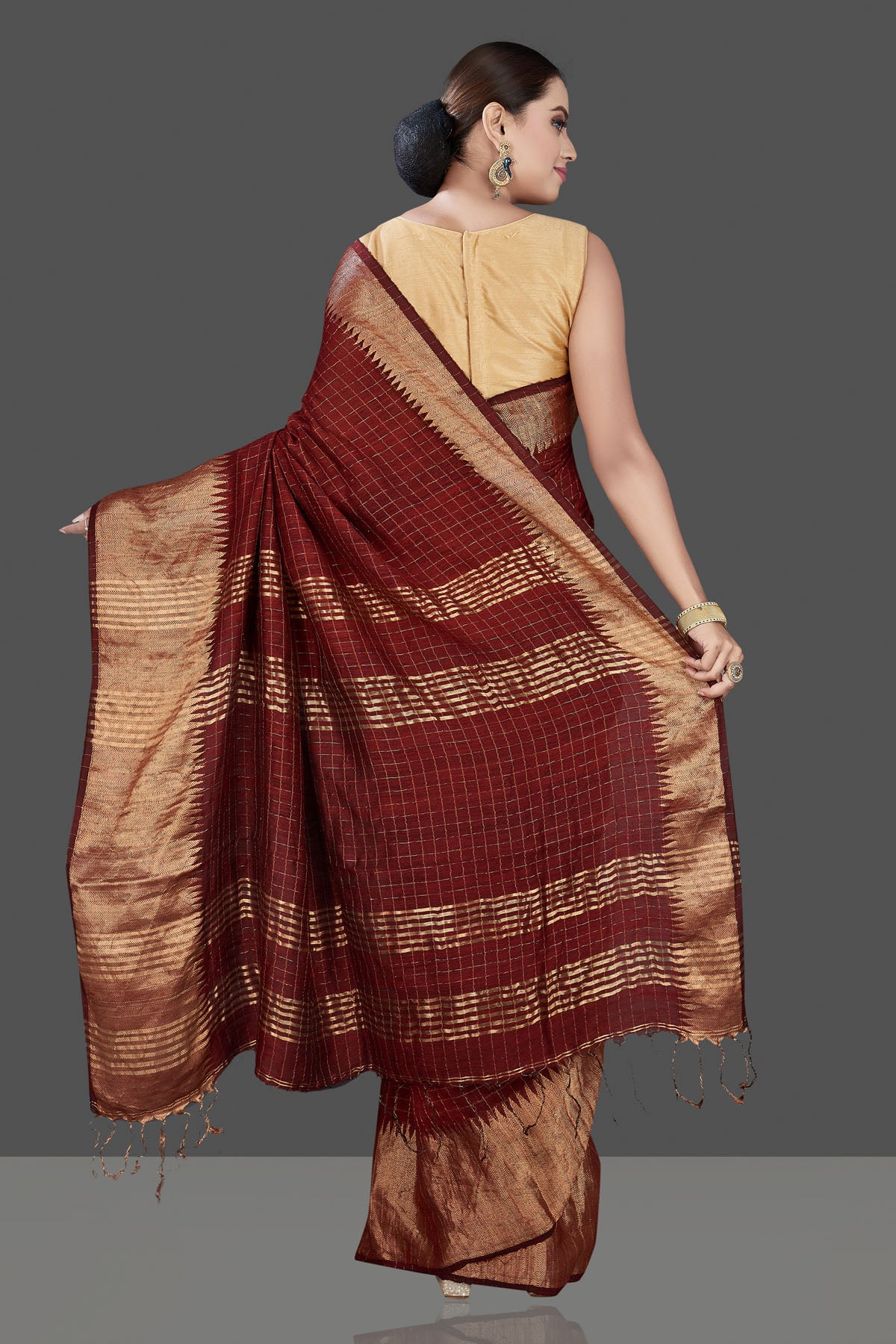 Buy stunning brown check matka silk saree online in USA with golden zari border. Be the talk of the occasion in exquisite designer sarees, pure silk sarees, tussar saris, embroidered sarees, handloom saris from Pure Elegance Indian fashion store in USA.-back