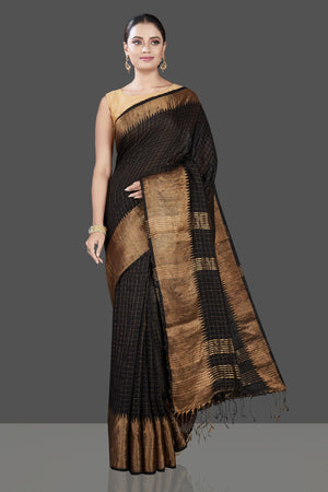 Shop gorgeous black matka silk sari online in USA with golden zari border. Be the talk of the occasion in exquisite designer sarees, pure silk sarees, tussar saris, embroidered sarees, handloom sarees from Pure Elegance Indian fashion store in USA.-front