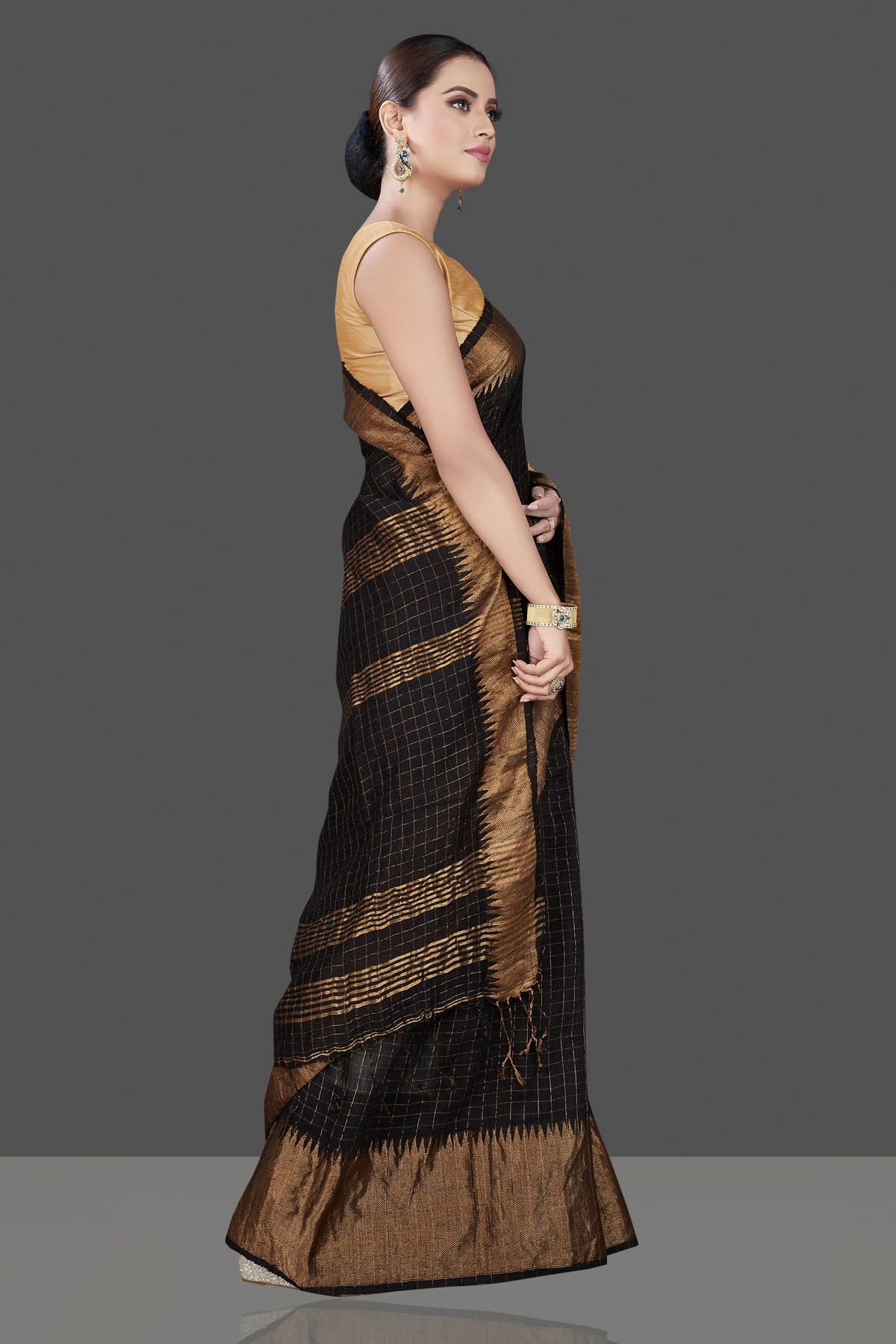 Shop gorgeous black matka silk sari online in USA with golden zari border. Be the talk of the occasion in exquisite designer sarees, pure silk sarees, tussar saris, embroidered sarees, handloom sarees from Pure Elegance Indian fashion store in USA.-side