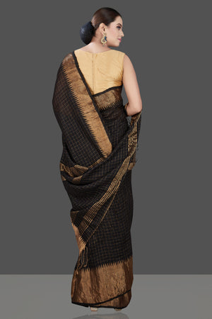 Shop gorgeous black matka silk sari online in USA with golden zari border. Be the talk of the occasion in exquisite designer sarees, pure silk sarees, tussar saris, embroidered sarees, handloom sarees from Pure Elegance Indian fashion store in USA.-back