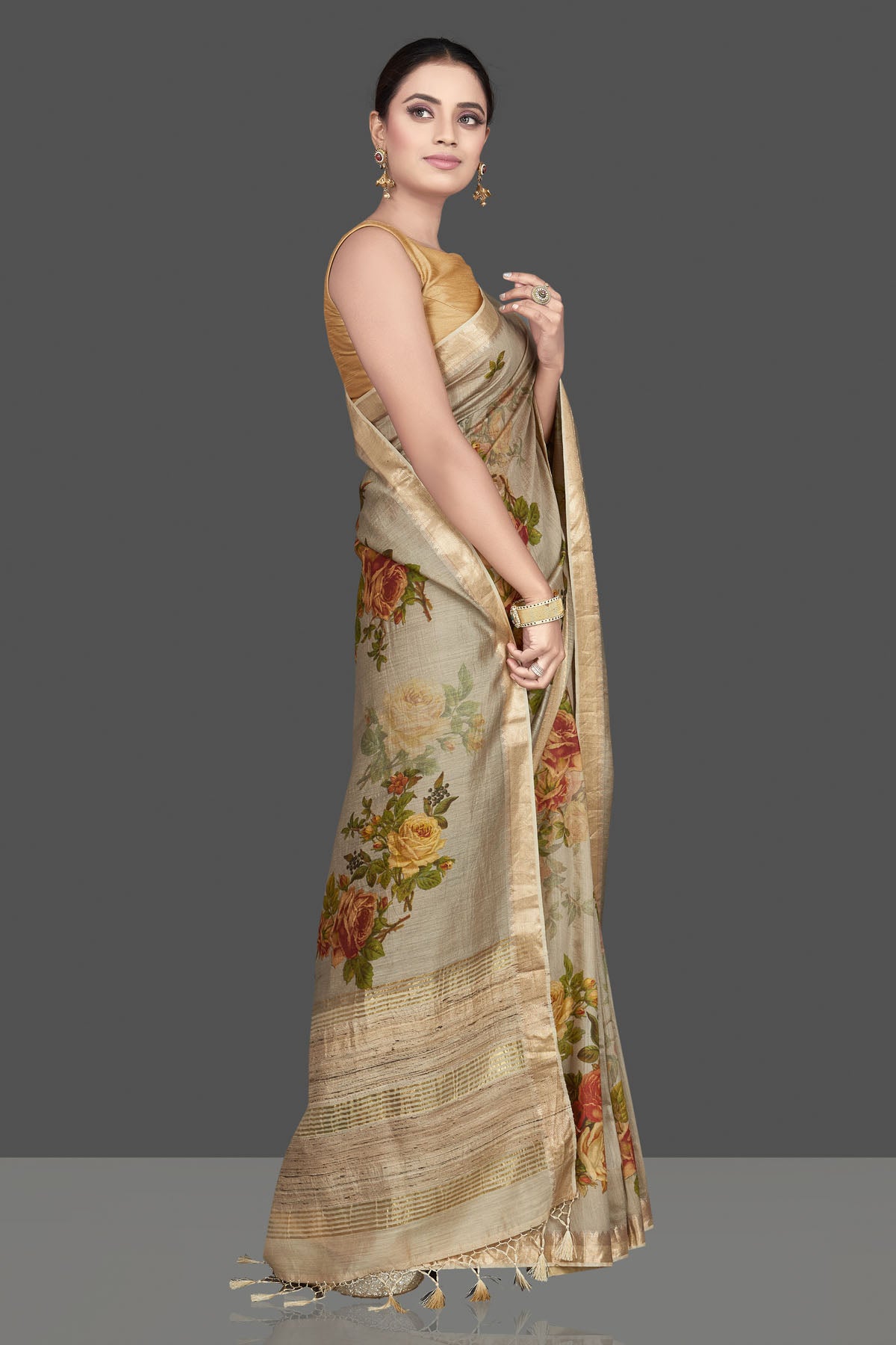 Shop gorgeous beige floral print Muga silk sari online in USA with golden border. Look attractive on weddings and parties in beautiful designer sarees, pure silk sarees, handwoven saris, embroidered sarees, zari work sarees from Pure Elegance Indian saree store in USA. -side