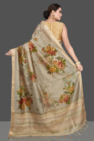 Shop gorgeous beige floral print Muga silk sari online in USA with golden border. Look attractive on weddings and parties in beautiful designer sarees, pure silk sarees, handwoven saris, embroidered sarees, zari work sarees from Pure Elegance Indian saree store in USA. -back