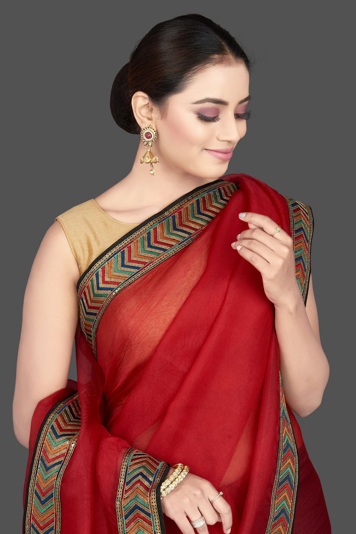 Shop gorgeous red organza saree online in USA with golden border. Look attractive on weddings and parties in beautiful designer sarees, pure silk sarees, handwoven saris, embroidered sarees, zari work sarees from Pure Elegance Indian saree store in USA.-closeup