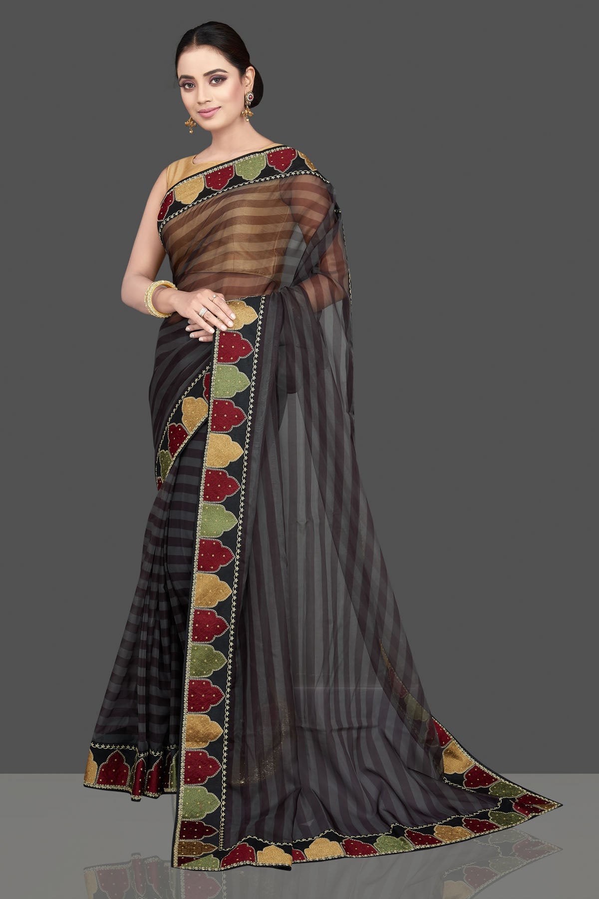 Buy gorgeous grey and black organza silk saree online in USA with designer border. Look attractive on weddings and parties in beautiful designer sarees, pure silk sarees, handwoven sarees, embroidered sarees, zari work sarees from Pure Elegance Indian saree store in USA.-pallu