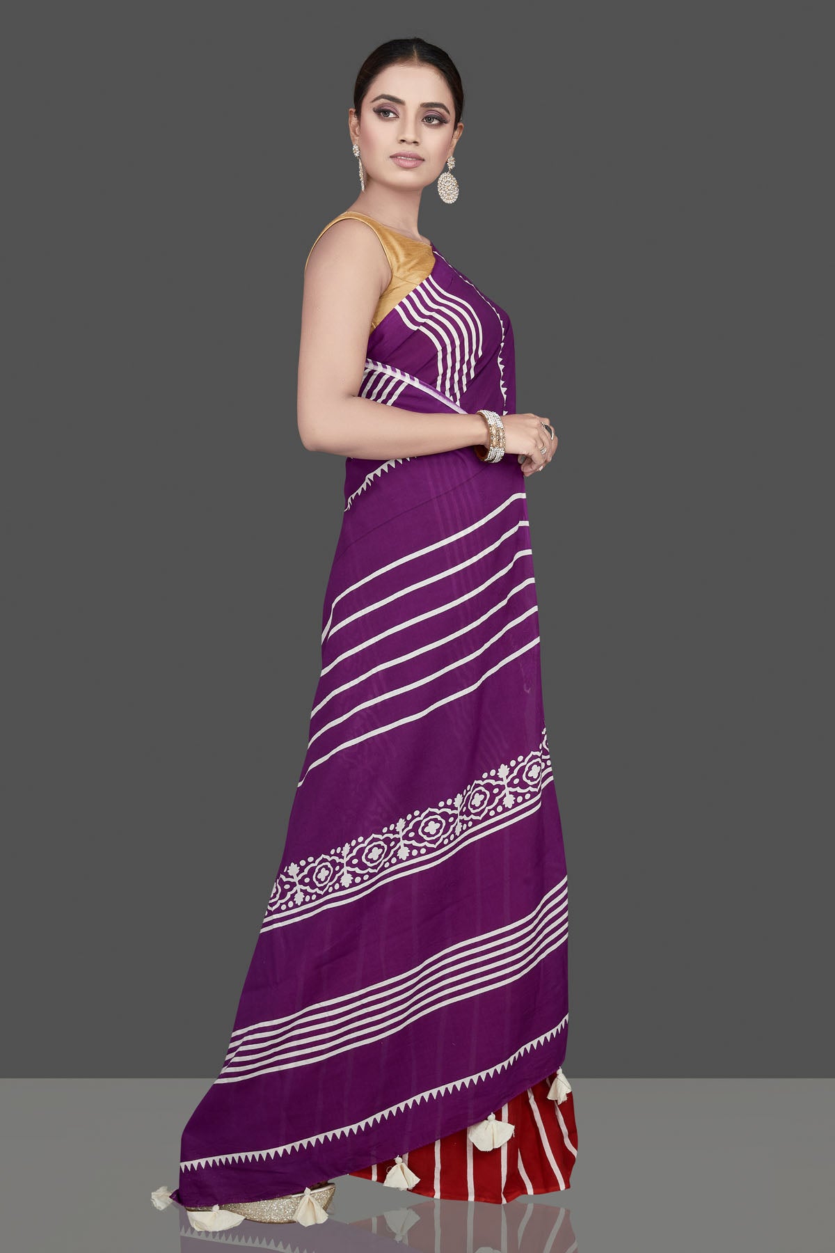 Buy gorgeous purple and red striped modal silk saree online in USA. Be the highlight of the occasion in beautiful pure silk saree, designer saris, handloom sarees, embroidered sarees, Kanchipuram sarees, Banarasi saris from Pure Elegance Indian saree store in USA.-side