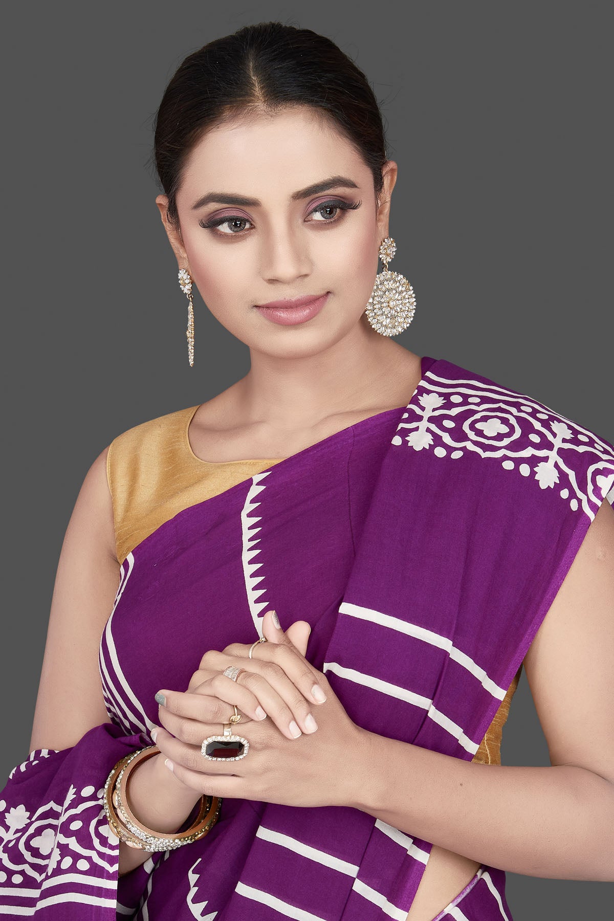 Buy gorgeous purple and red striped modal silk saree online in USA. Be the highlight of the occasion in beautiful pure silk saree, designer saris, handloom sarees, embroidered sarees, Kanchipuram sarees, Banarasi saris from Pure Elegance Indian saree store in USA.-closeup