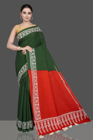 Shop gorgeous green and red modal silk saree online in USA with printed white border. Be the highlight of the occasion in beautiful pure silk saree, designer saris, handloom sarees, embroidered sarees, Kanchipuram sarees, Banarasi saris from Pure Elegance Indian saree store in USA.-front