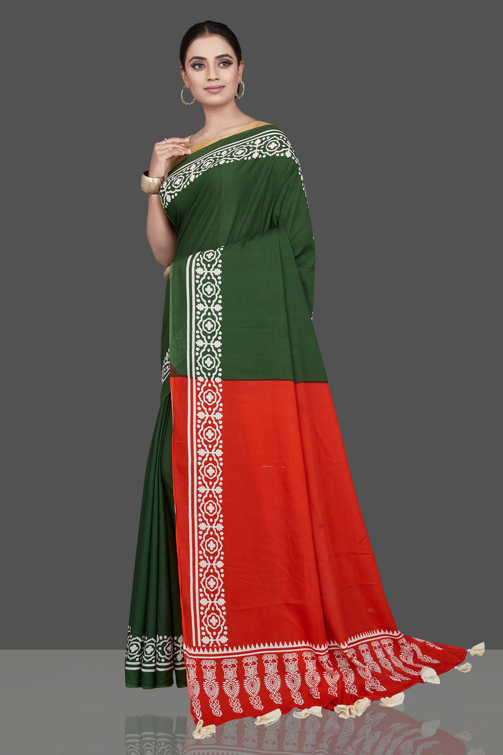 Shop gorgeous green and red modal silk saree online in USA with printed white border. Be the highlight of the occasion in beautiful pure silk saree, designer saris, handloom sarees, embroidered sarees, Kanchipuram sarees, Banarasi saris from Pure Elegance Indian saree store in USA.-full view