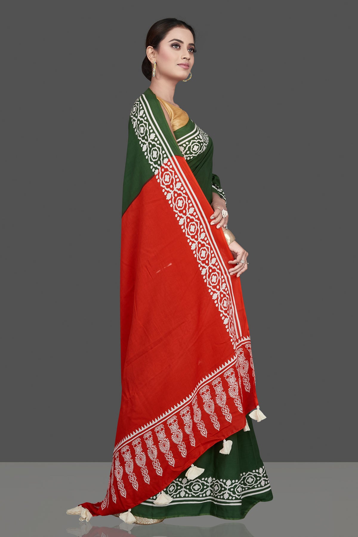 Shop gorgeous green and red modal silk saree online in USA with printed white border. Be the highlight of the occasion in beautiful pure silk saree, designer saris, handloom sarees, embroidered sarees, Kanchipuram sarees, Banarasi saris from Pure Elegance Indian saree store in USA.-side