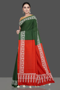 Buy gorgeous red and green modal silk saree online in USA with white print border. Be the highlight of the occasion in beautiful pure silk saree, designer saris, handloom sarees, embroidered sarees, Kanchipuram sarees, Banarasi saris from Pure Elegance Indian saree store in USA.-full view