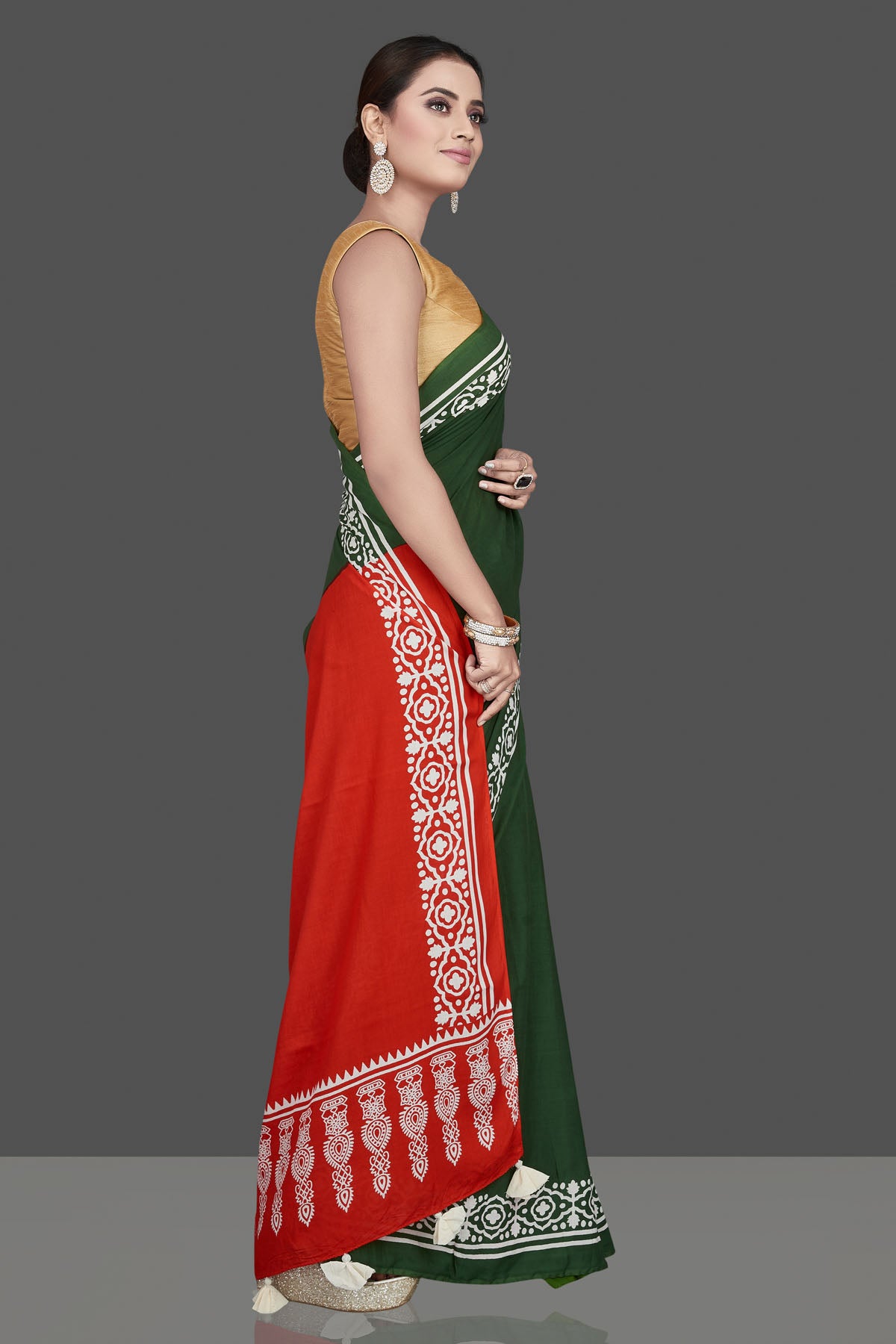 Buy gorgeous red and green modal silk saree online in USA with white print border. Be the highlight of the occasion in beautiful pure silk saree, designer saris, handloom sarees, embroidered sarees, Kanchipuram sarees, Banarasi saris from Pure Elegance Indian saree store in USA.-side