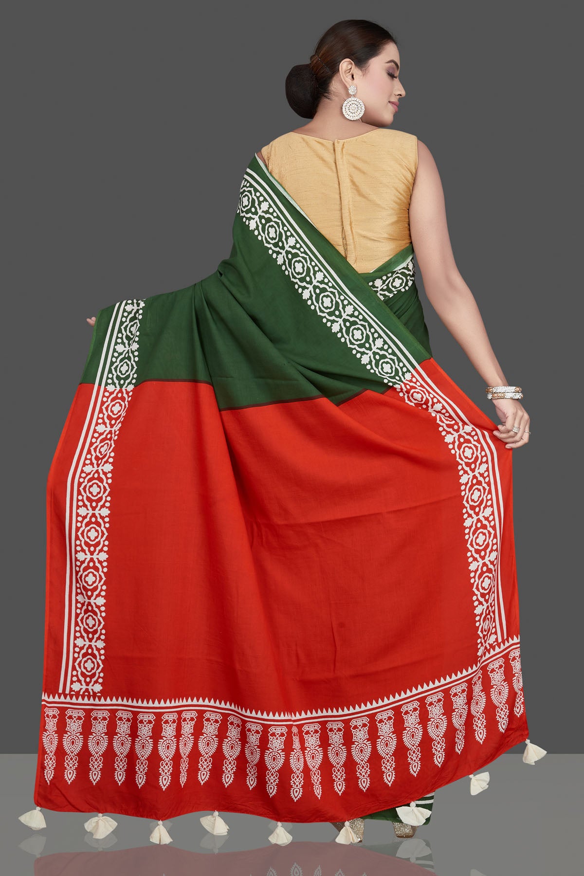 Buy gorgeous red and green modal silk saree online in USA with white print border. Be the highlight of the occasion in beautiful pure silk saree, designer saris, handloom sarees, embroidered sarees, Kanchipuram sarees, Banarasi saris from Pure Elegance Indian saree store in USA.-back