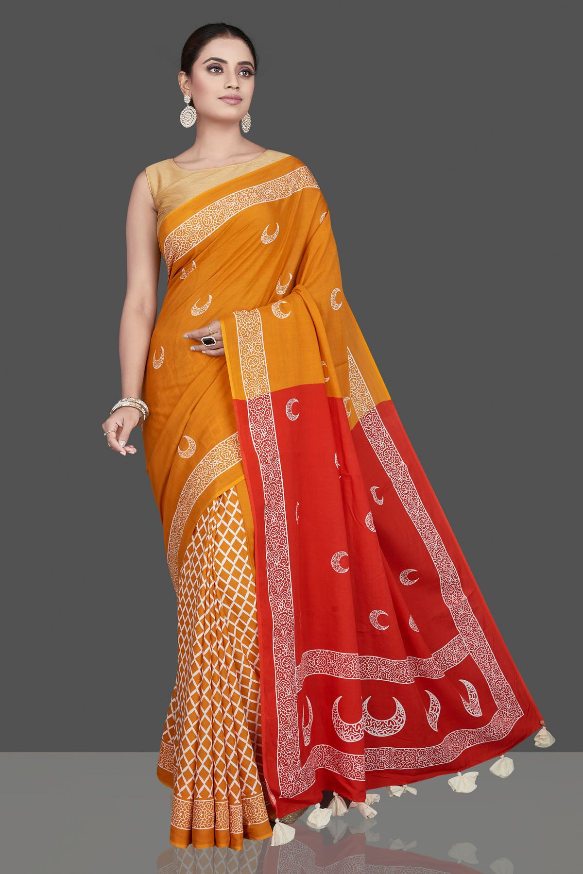 Buy beautiful yellow printed modal silk saree online in USA with red pallu. Be the highlight of the occasion in beautiful pure silk saree, designer saris, handloom sarees, embroidered sarees, Kanchipuram sarees, Banarasi saris from Pure Elegance Indian saree store in USA.-front