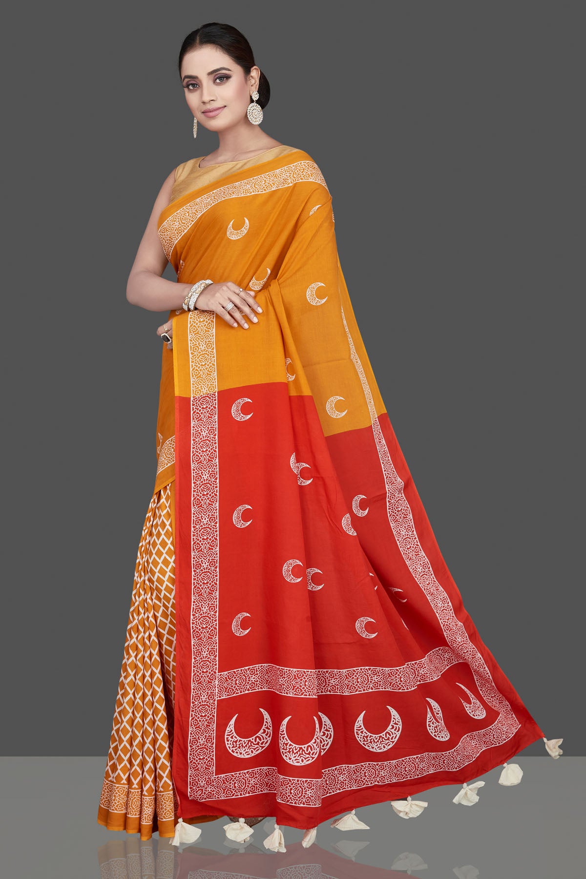 Buy beautiful yellow printed modal silk saree online in USA with red pallu. Be the highlight of the occasion in beautiful pure silk saree, designer saris, handloom sarees, embroidered sarees, Kanchipuram sarees, Banarasi saris from Pure Elegance Indian saree store in USA.-pallu