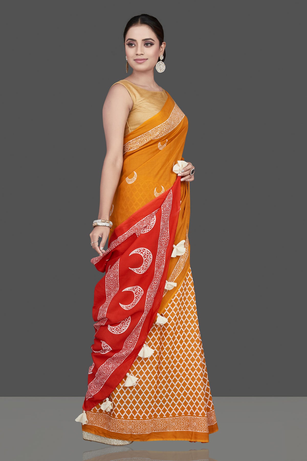 Buy beautiful yellow printed modal silk saree online in USA with red pallu. Be the highlight of the occasion in beautiful pure silk saree, designer saris, handloom sarees, embroidered sarees, Kanchipuram sarees, Banarasi saris from Pure Elegance Indian saree store in USA.-side