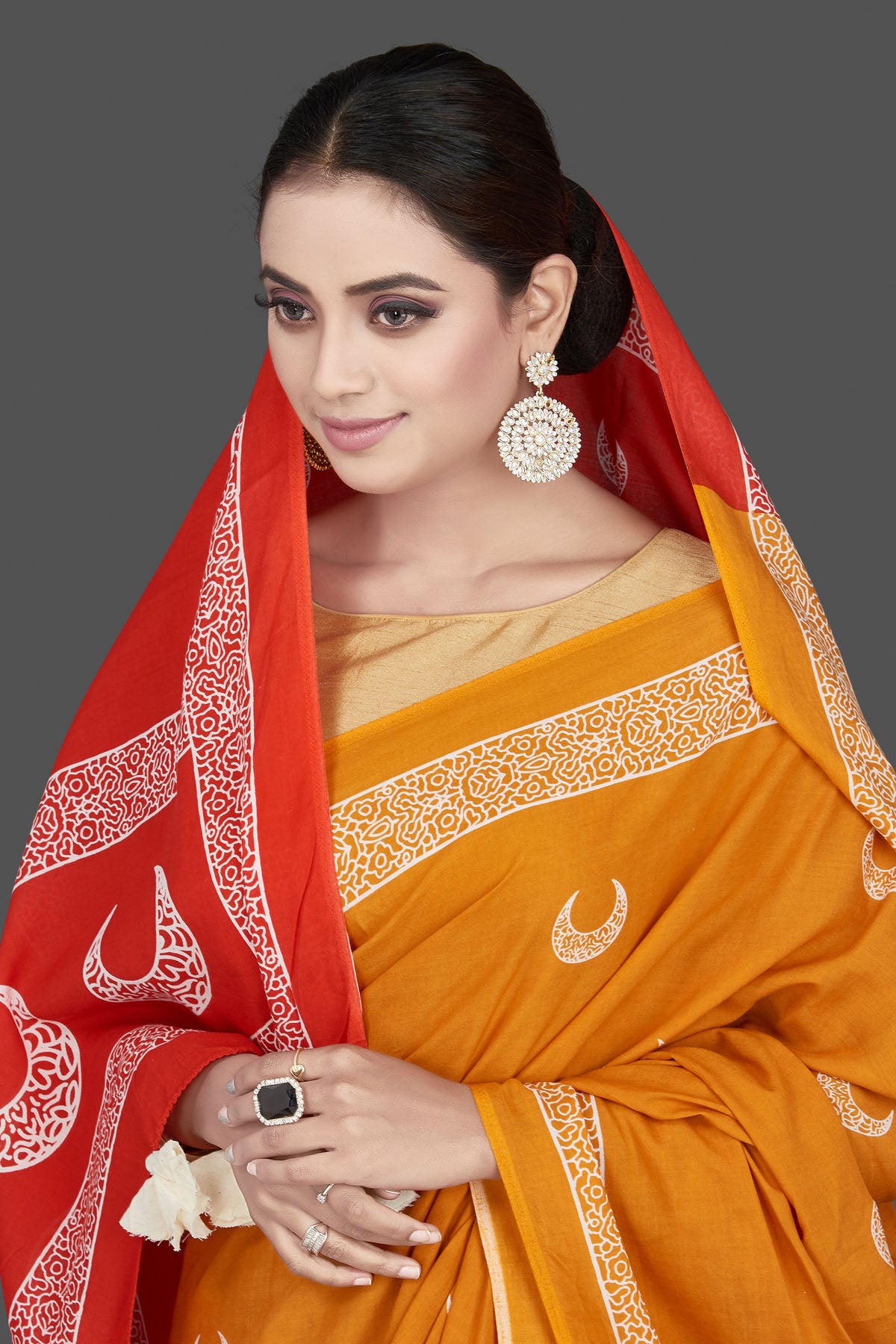 Buy beautiful yellow printed modal silk saree online in USA with red pallu. Be the highlight of the occasion in beautiful pure silk saree, designer saris, handloom sarees, embroidered sarees, Kanchipuram sarees, Banarasi saris from Pure Elegance Indian saree store in USA.-closeup