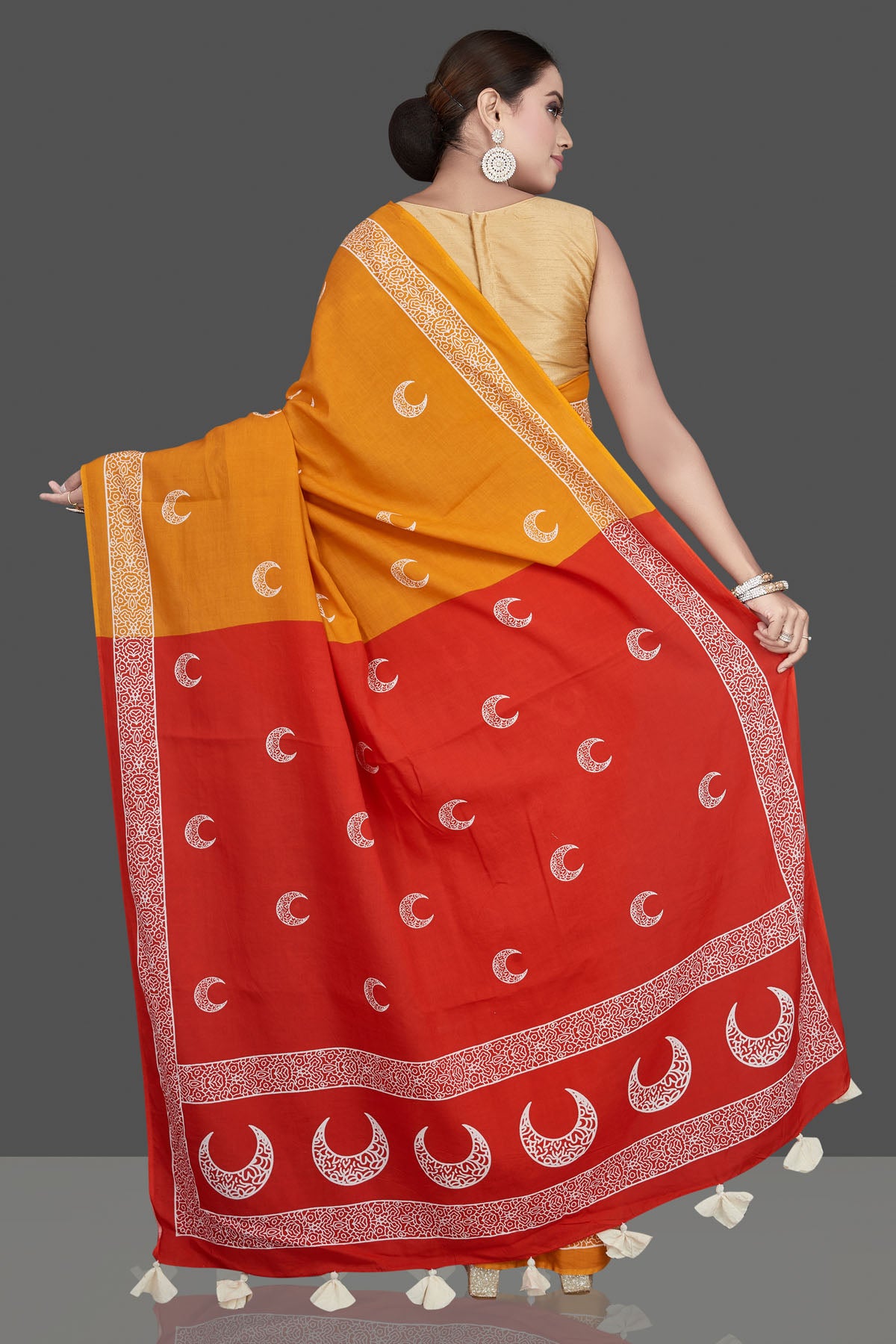 Buy beautiful yellow printed modal silk saree online in USA with red pallu. Be the highlight of the occasion in beautiful pure silk saree, designer saris, handloom sarees, embroidered sarees, Kanchipuram sarees, Banarasi saris from Pure Elegance Indian saree store in USA.-back