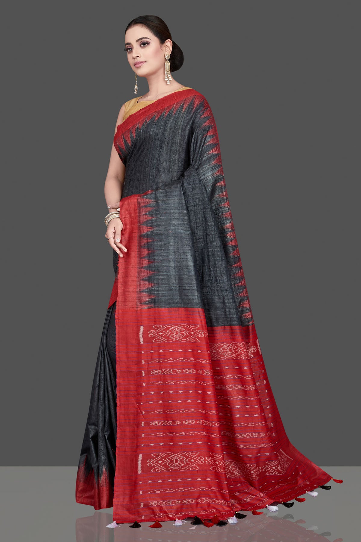 Shop beautiful black Gopalpur tussar silk saree online in USA with red temple border. Flaunt ethnic fashion on special occasions in stunning georgette sarees, designer saris, embroidered sarees, pure silk sarees, Kanchipuram saris from Pure Elegance Indian fashion store in USA.-full view
