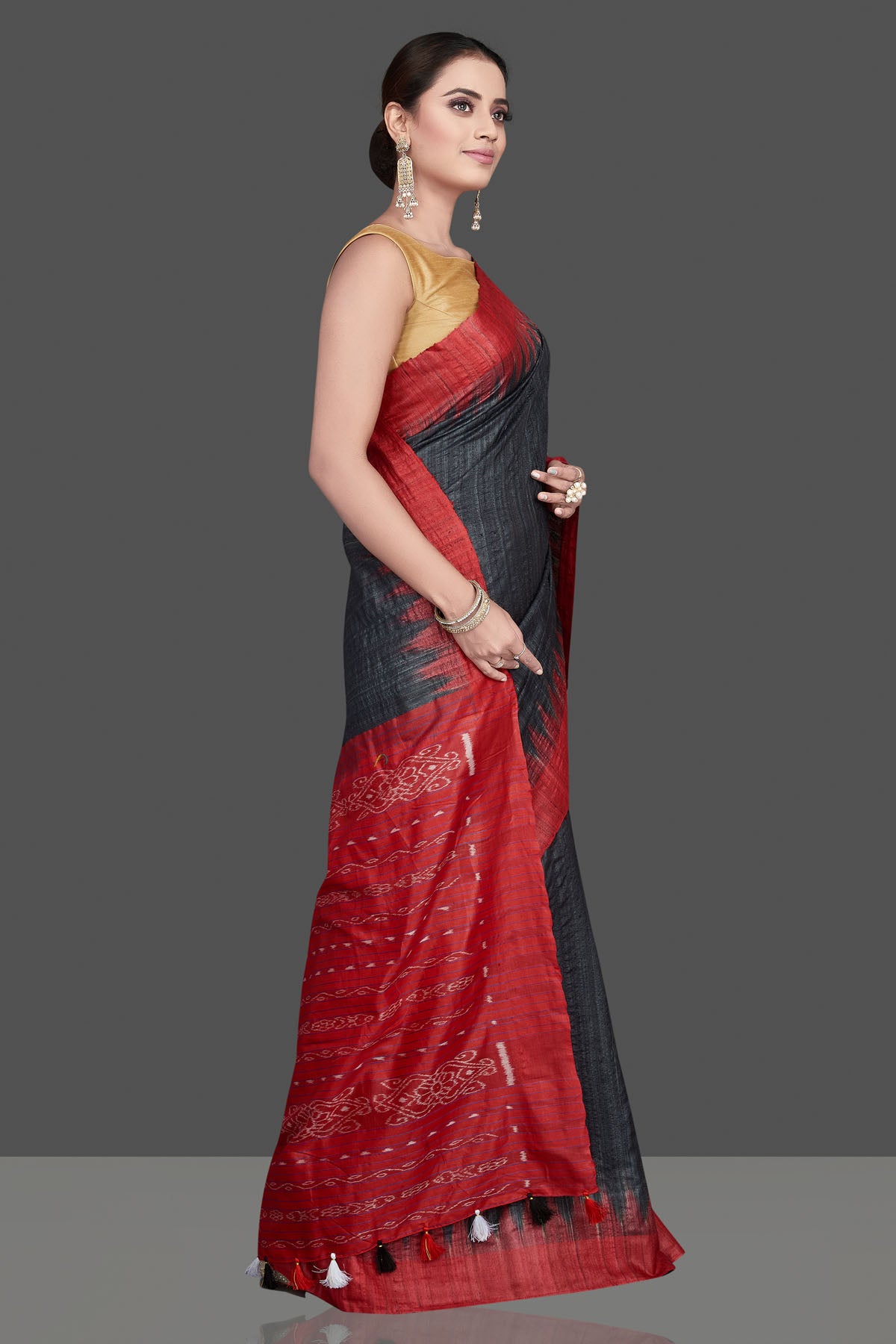 Shop beautiful black Gopalpur tussar silk saree online in USA with red temple border. Flaunt ethnic fashion on special occasions in stunning georgette sarees, designer saris, embroidered sarees, pure silk sarees, Kanchipuram saris from Pure Elegance Indian fashion store in USA.-side