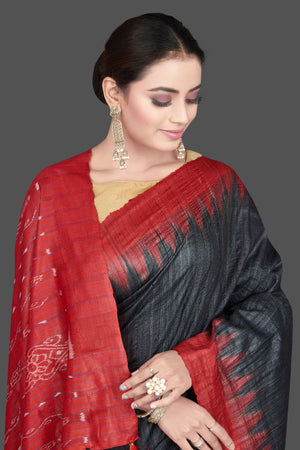 Shop beautiful black Gopalpur tussar silk saree online in USA with red temple border. Flaunt ethnic fashion on special occasions in stunning georgette sarees, designer saris, embroidered sarees, pure silk sarees, Kanchipuram saris from Pure Elegance Indian fashion store in USA.-closeup